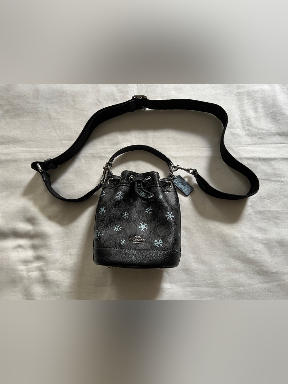 Coach Dempsey Drawstring Bucket Bag 15 In Signature Canvas With Snowflake Print